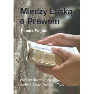 Mi�dzy �ask� a Prawem - Tomasz  Wojta�