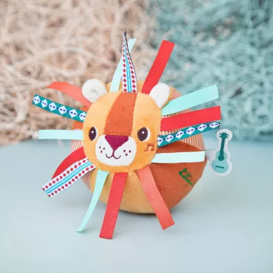 Lilliputiens Pieczka sensoryczna z dzwoneczkiem i wypustkami Lew Jack 6 m+